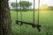 Green meadow and wood swings