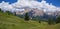 Green Meadows, Fir Trees and Italian Alps Mountains in the Background on a Summer Day - San Vigilio Marebbe, Italy