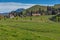 Green meadows and mountain houses above Lake Lucerne, Alps, Switzerland