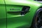 Green Mercedes-Benz AMG GTR 2018 V8 Bi-turbo exterior details. Side view. Car exterior details