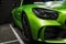 Green Mercedes-Benz AMG GTR 2018 V8 Biturbo exterior details, Headlight. Front view. Car exterior details