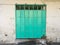 Green metal collapsible vintage door in Penang Malaysia