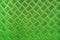 Green metal surface background with repeative diamond pattern