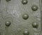 Green military metal armored sheet with rivets. texture for design and steampunk