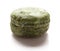 Green moldy macaroon on a white background