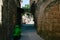 Green moped in an old alley