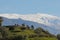 Green mount of Granada with a view of Sierra Nevada