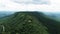 Green mountain and light blue sky