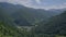 Green mountain and river shot from top view