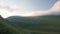 Green mountain and valley landscape timelapse. Highlands and cloudy sky