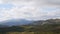 Green mountains. Cloudy sky and hills meadow. Panning. Beautiful Panoramic View