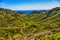 Green mountains or rocks valley with road