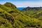 Green mountains or rocks with winding road