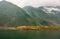 Green mountains under misty cloudscape along Daning River, Wuchan, China