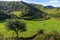 Green mountains in Zumaia under blue sky