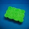 Green multifunctional sponge on a blue background