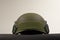 Green nato military helmet on white background