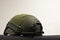 Green nato military helmet on white background