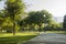 Green Neighborhood Park with a light post and a pedestrian walkway