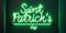 green neon illuminated banner text Saint Patrick's day on wall, poster