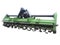 Green new farm cultivator plow for tractors isolated over white