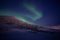 Green northen light changing itÂ´s shape with stars shining in polar night
