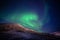 Green northen light changing itÂ´s shape with stars shining in polar night