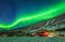 Green northern lights over rural county of northern Norway