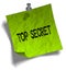 Green note paper with TOP SECRET message and push pin illustration.