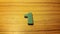 green number 1 on wooden background