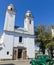 Green and obsolete car, in front of the church of Colonia del Sacramento, Uruguay. It is one of the oldest cities in Uruguay