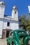 Green and obsolete car, in front of the church of Colonia del Sacramento, Uruguay. It is one of the oldest cities in Uruguay