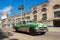Green, old american classical car in road of old Havana Cuba