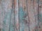Green old painted wooden background. Aged boards, front view