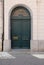 Green old textured wood door at Brussels, Belgium