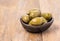 Green olives in olive bowl