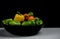 Green and orange peppers on timeless still life