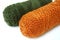 Green and orange yarn rolls