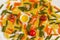 Green, orange and yellow Fusilli pasta background
