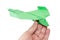 Green origami plane in the hand flying