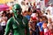 Green painted Man parades his snake replica during a town festivity to honor Patron Saint Paul the First Hermit Feast.