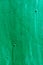 Green painted metal sheet with rivets diagonally