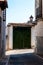 Green painted wooden doorway in the historic center of a village