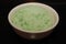Green pandan rice in white bowl