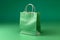 A green paper shopping bag isolated on green background, mock up, no brand, product advertising, online shopping promotion.