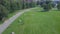 Green Park and its vast lawns on a sunny spring day. Clip. Aerial from flying drone of a city park with walking path and