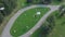 Green Park and its vast lawns on a sunny spring day. Clip. Aerial from flying drone of a city park with walking path and