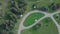 Green Park and its vast lawns on a sunny spring day. Clip. Aerial from flying drone of a city park with walking path and