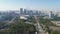 Green Park and Shanghai Downtown at Sunny Day. China. Aerial View. Drone is Flying Forward and Up