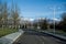 Green park with trees and snowy mountains view